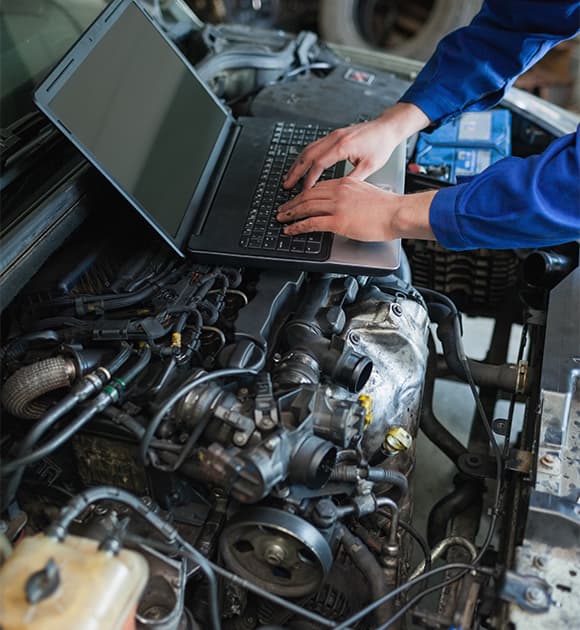 Mechanic working under a lifted vehicle